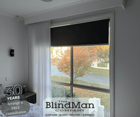 Black roller blinds in bedroom