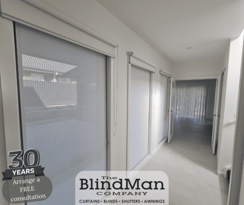 White roller blinds on doors