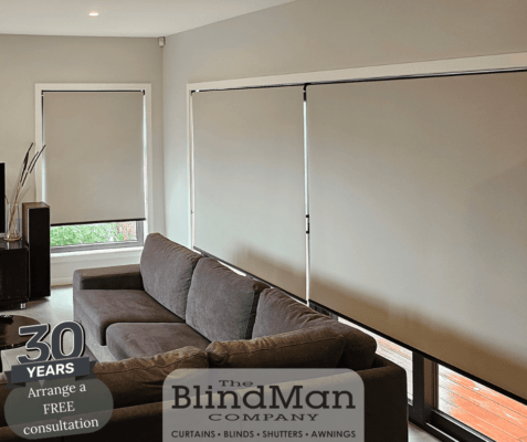 White roller blinds on windows